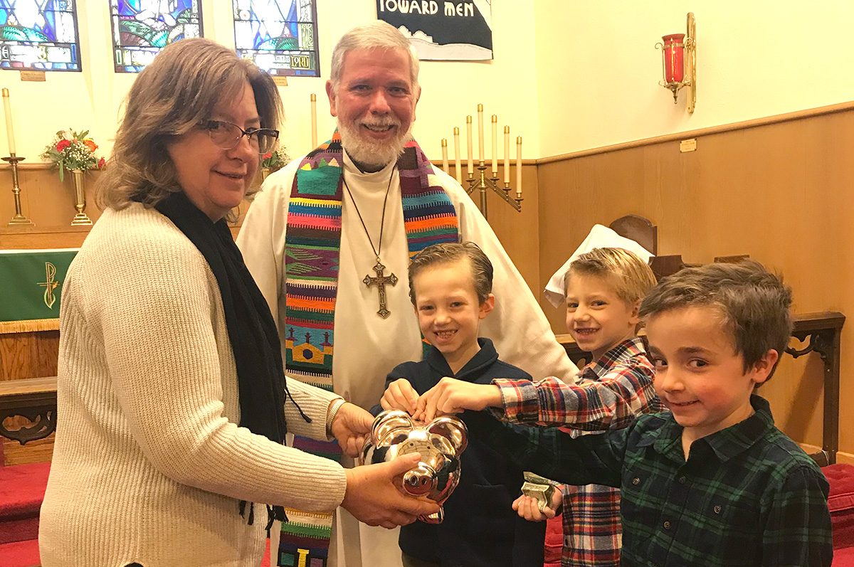 St. Paul's Sunday School children "Feed the Pig" in a fund raising effort to help people through Lutheran World Relief on a recent Sunday morning.